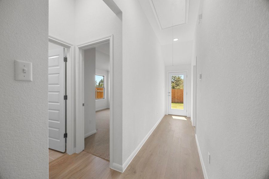 Hallway in the Cypress home plan by Trophy Signature Homes - REPRESENTATIVE PHOTO