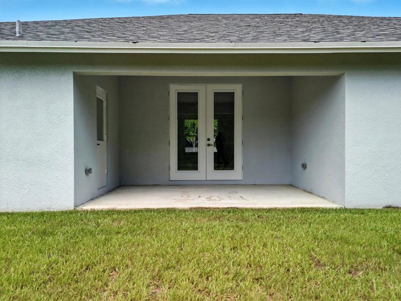 Front exterior of a new home in , Fort Pierce, FL, highlighting curb appeal (Image 1).