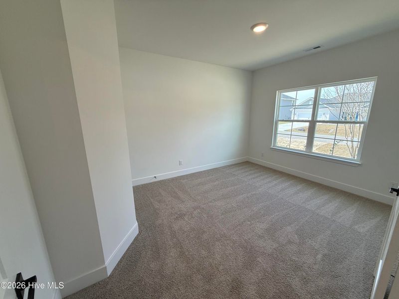 Spacious, unfurnished interior of a new home in Wood Creek Landing, Leland (Image 21).