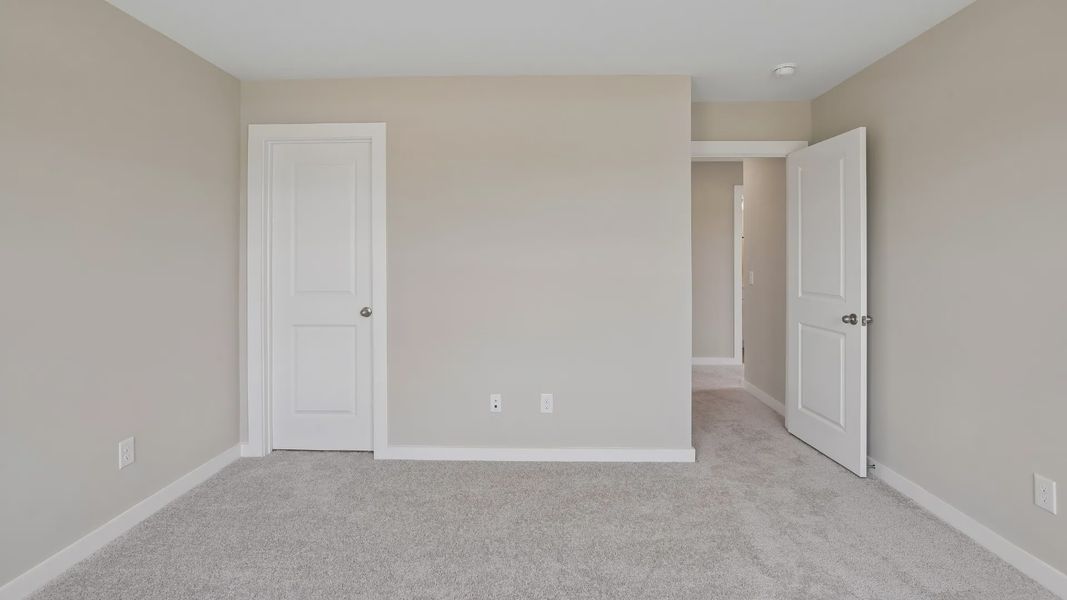 Bedroom with walk-in closet and windows Bedroom with walk-in closet and windows