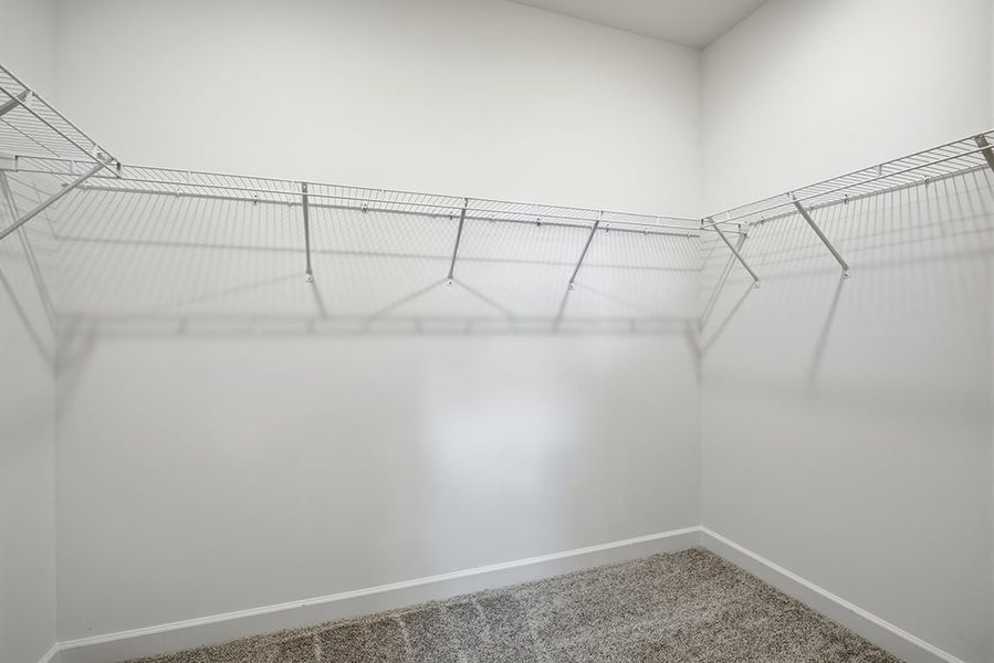 A white wall with a metal railing. A white wall with a metal railing.