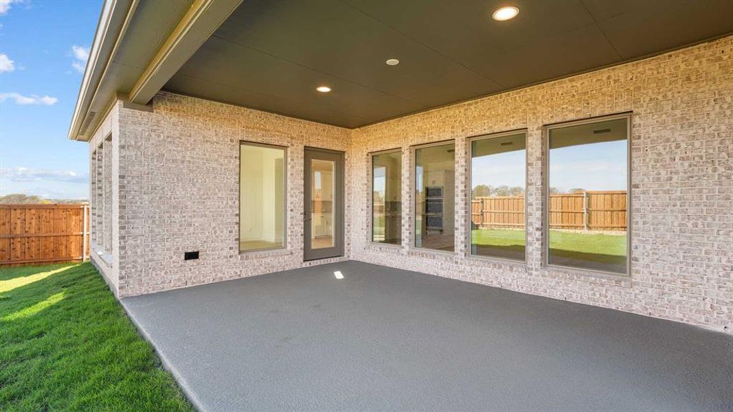 Exterior details and patio area of a home in Terraces 72', Rockwall (Image 4). Exterior details and patio area of a home in Terraces 72', Rockwall (Image 4).