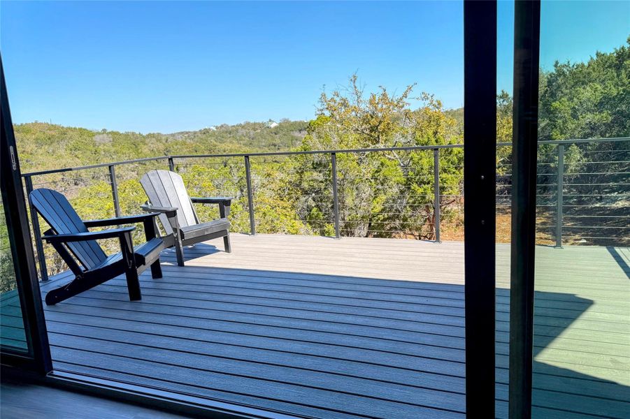 Wooden deck featuring a wooded view