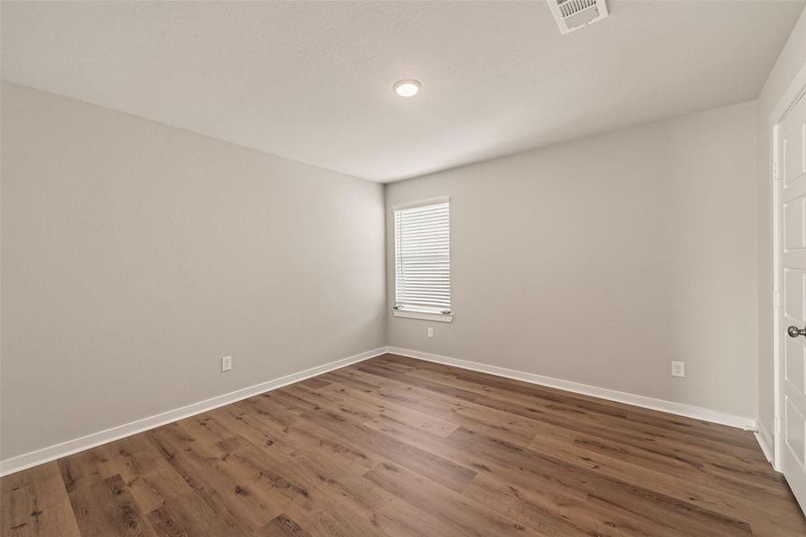 Three secondary bedrooms are conveniently located upstairs just off the game room, creating a functional layout with space for family, guests, or a home office. Three secondary bedrooms are conveniently located upstairs just off the game room, creating a functional layout with space for family, guests, or a home office.