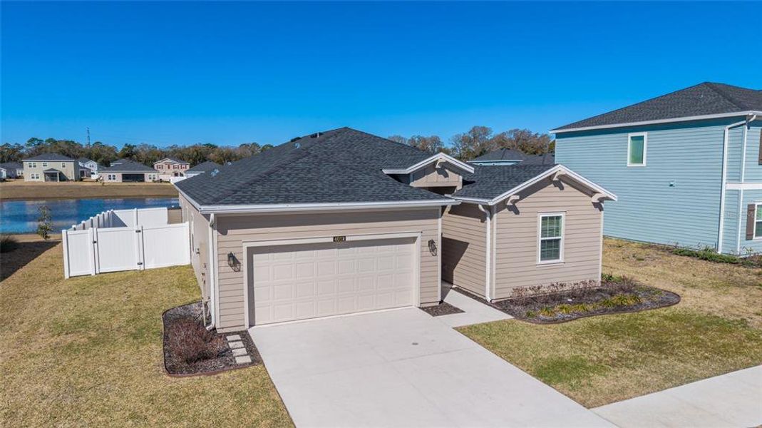 Front exterior of a new home in Millwood, Ocala, FL, highlighting curb appeal (Image 27).