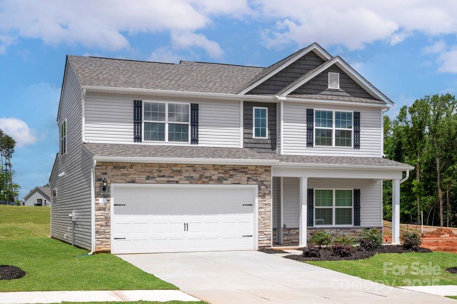 Front exterior of a new home in Ascot Woods, Charlotte, NC, highlighting curb appeal (Image 2). Front exterior of a new home in Ascot Woods, Charlotte, NC, highlighting curb appeal (Image 2).