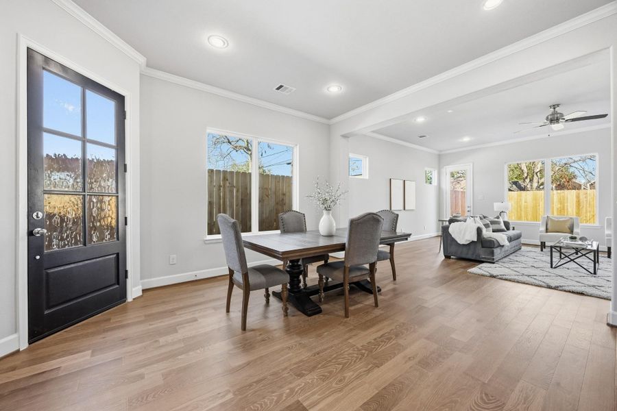 Central Sophistication: Right where family and friends converge, this dining room is the true heart of the home, bathed in welcoming natural light.