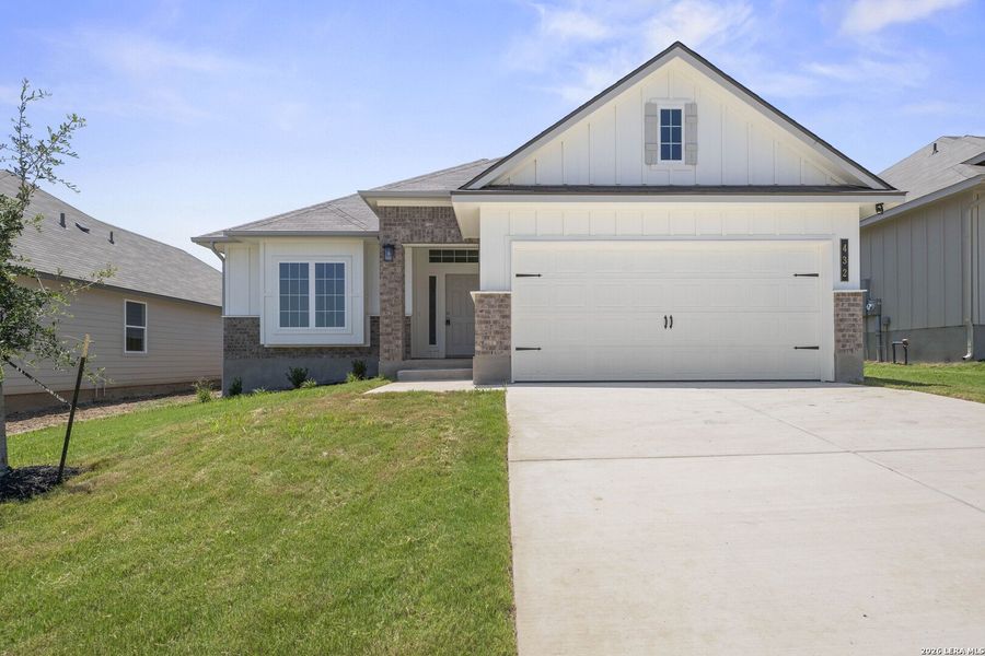 Front exterior of a new home in Arroyo Ranch, Seguin, TX, highlighting curb appeal (Image 1). Front exterior of a new home in Arroyo Ranch, Seguin, TX, highlighting curb appeal (Image 1).