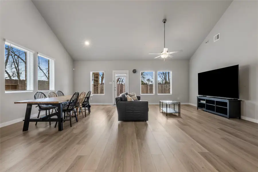 Spacious and light-filled living area designed for comfort and everyday living. The open layout provides ample room for seating and entertainment, with large windows that allow natural light to flow throughout the space.