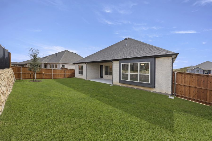 Exterior details and patio area of a home in Brookshire at Legacy Hills, Celina (Image 19).