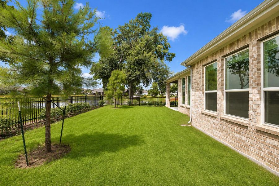 The generous Backyard offers an abundance of green space, providing the perfect setting for children to play, pets to roam, and outdoor memories to be made. With ample room to customize, there is plenty of space to add a sparkling pool, raised garden beds, or other outdoor enhancements, allowing you to create the Backyard oasis of your dreams.