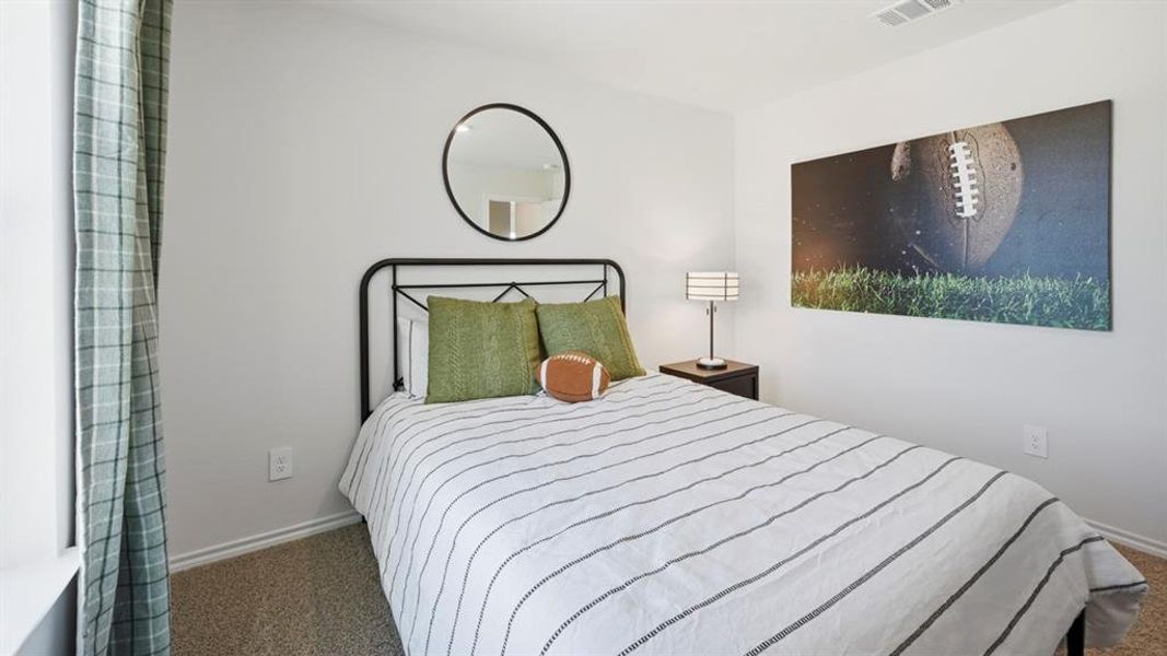 Bedroom with carpet and baseboards Bedroom with carpet and baseboards