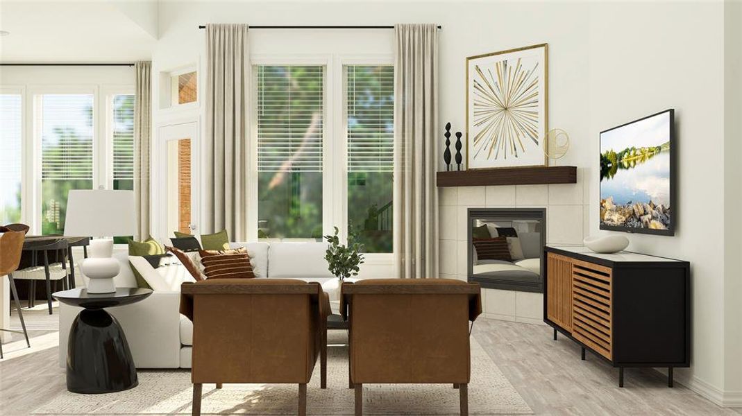 Living room featuring a tiled fireplace and light wood-type flooring