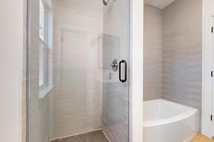 Full bathroom with a bath and a shower stall