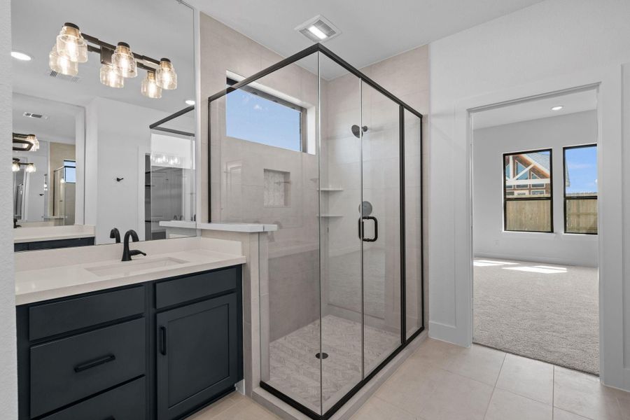 Enjoy this luxurious main bathroom shower laced with beautiful design selections. Enjoy this luxurious main bathroom shower laced with beautiful design selections.