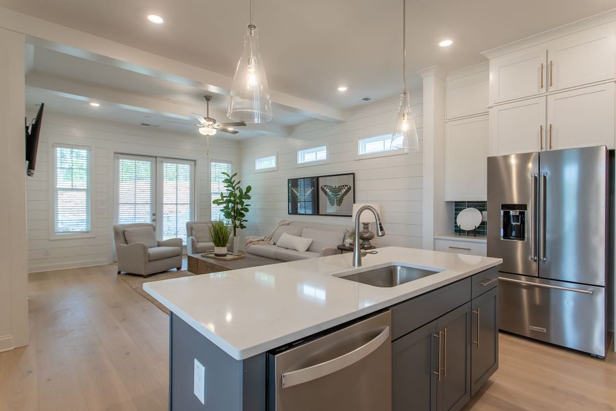 The large kitchen overlooks the formal dining area and family room