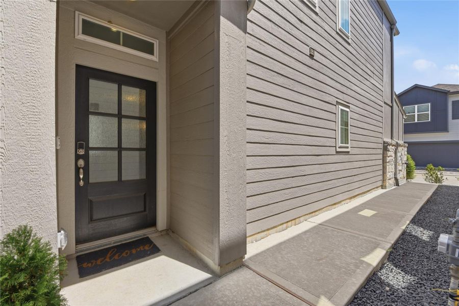 Exterior details and patio area of a home in Dunvale Village - Townhome Collection, Houston (Image 25).