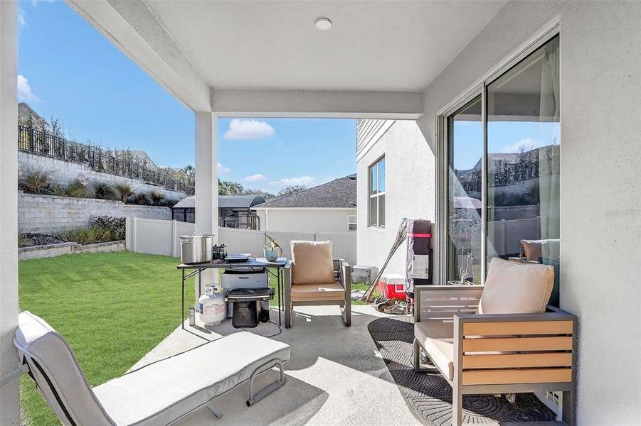 Exterior details and patio area of a home in The Reserve at Lake Ridge, Minneola (Image 28).