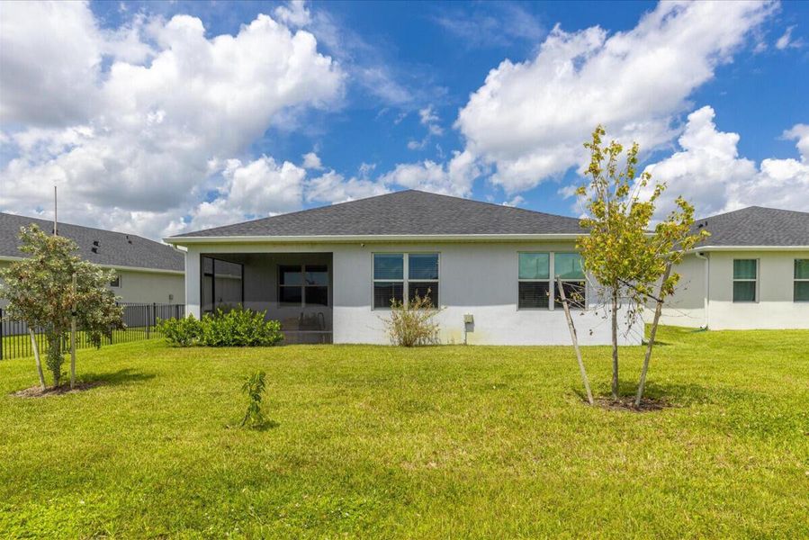 Front exterior of a new home in Azalea, Port St. Lucie, FL, highlighting curb appeal (Image 18).