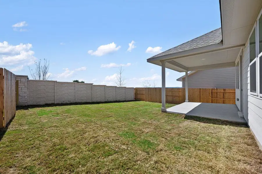 Exterior details and patio area of a home in Cannon Ranch, Dripping Springs (Image 4).