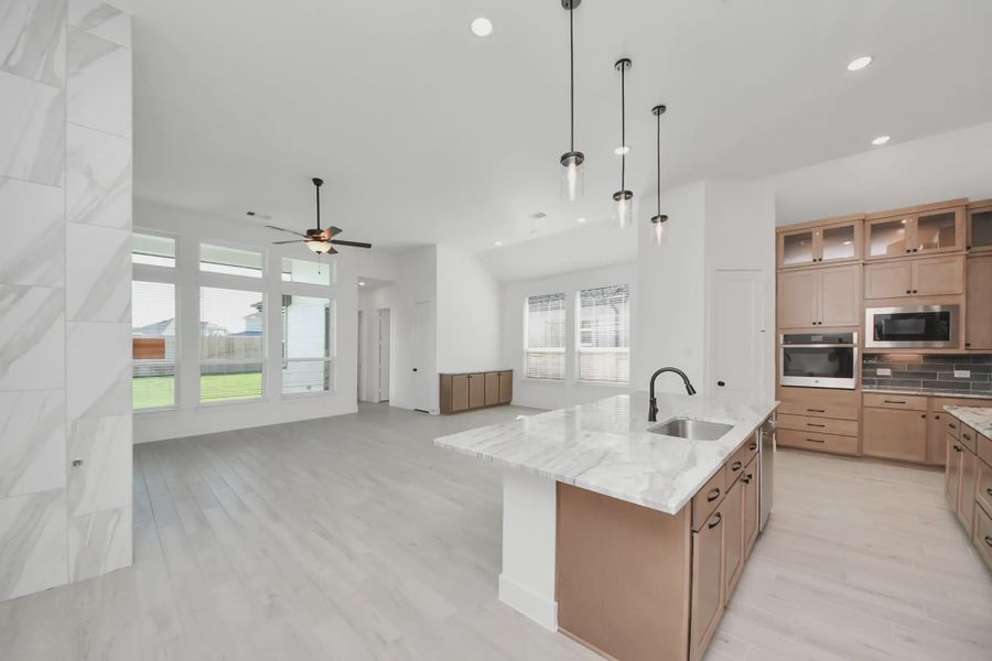 Representative furnished interior of a home built from the Summerton by Chesmar Homes in Meridiana 50's and 60's, Manvel (Image 14).