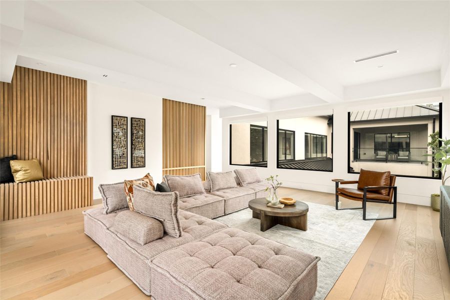 This angle truly showcases a wide, light-filled perspective with clean lines and custom wood detailing.