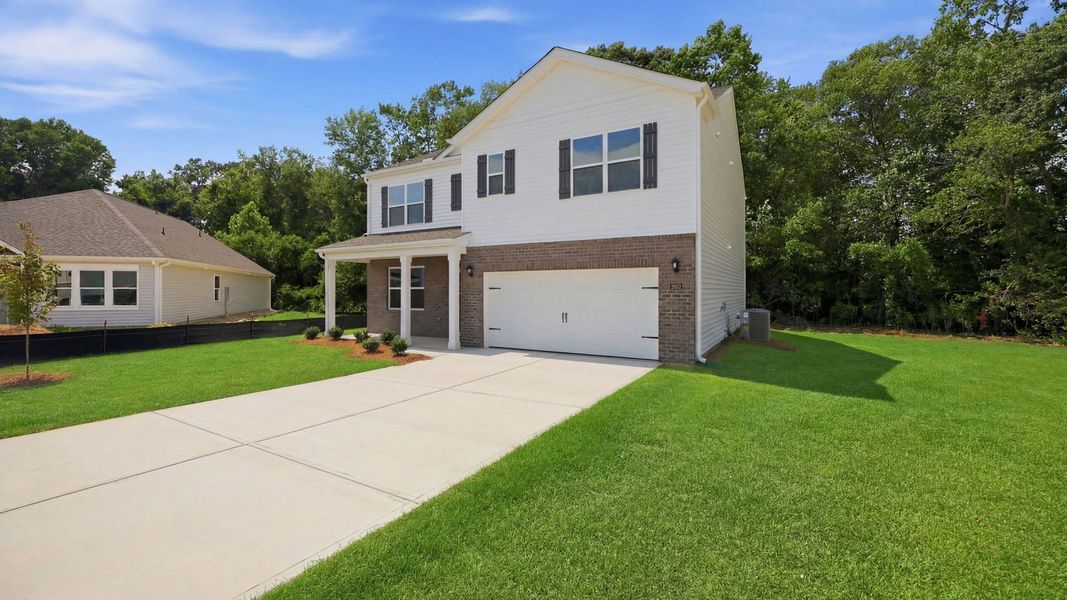 Front exterior of a new home in Villa Grande, Winterville, NC, highlighting curb appeal (Image 2). Front exterior of a new home in Villa Grande, Winterville, NC, highlighting curb appeal (Image 2).