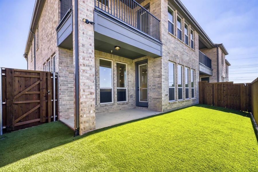 Exterior details and patio area of a home in Castle Hills Northpointe - Townhomes, Lewisville (Image 4).