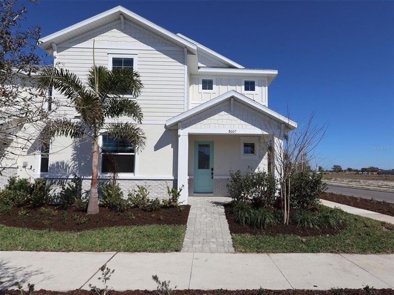 Front exterior of a new home in SeaFlower, Bradenton, FL, highlighting curb appeal (Image 20).