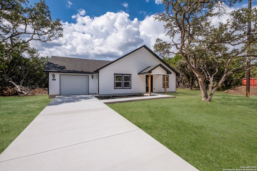 Front exterior of a new home in , Bandera, TX, highlighting curb appeal (Image 1). Front exterior of a new home in , Bandera, TX, highlighting curb appeal (Image 1).
