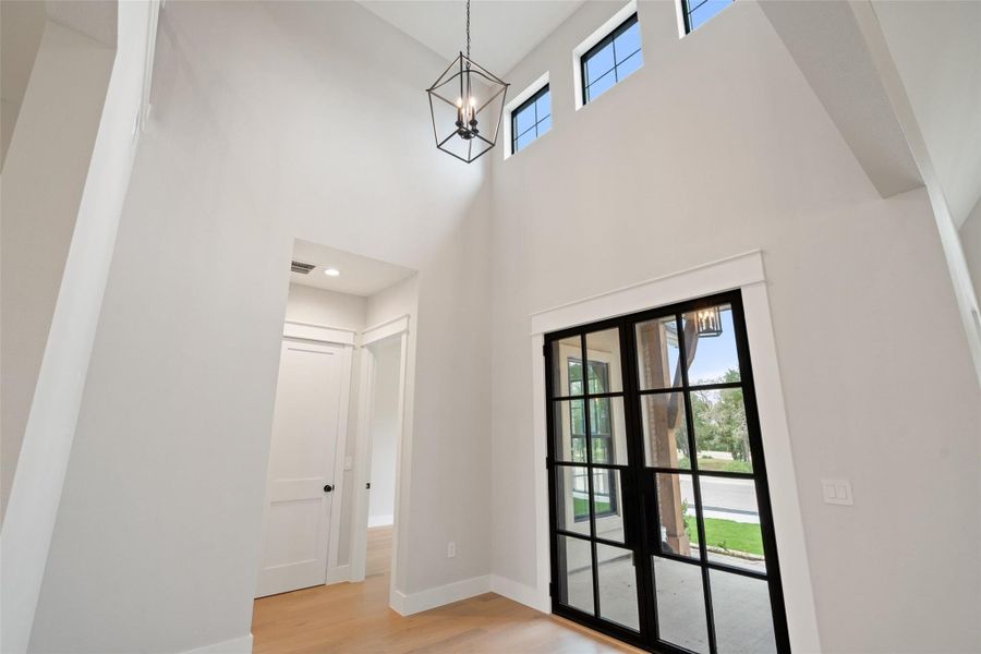 Enter into soaring ceilings and natural light from transom windows above the main entry. Enter into soaring ceilings and natural light from transom windows above the main entry.