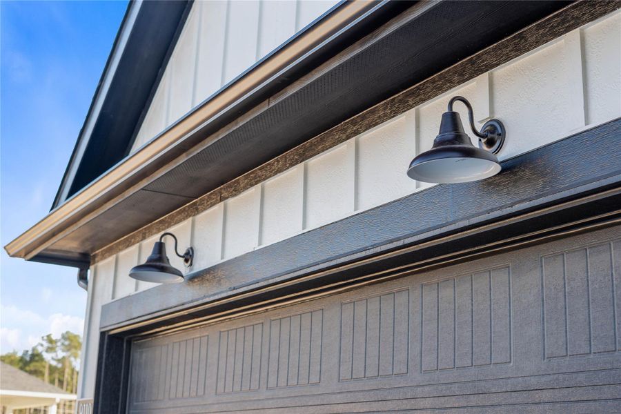 The property features stylish matte black gooseneck barn lights - providing ample illumination for safety and ambiance. The property features stylish matte black gooseneck barn lights - providing ample illumination for safety and ambiance.