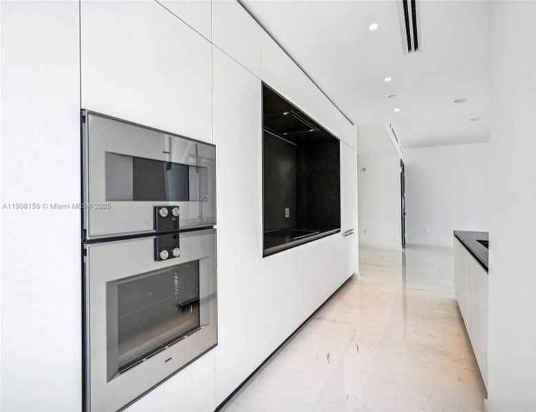 Furnished interior view inside a new home in Aston Martin Residences, Miami (Image 2).