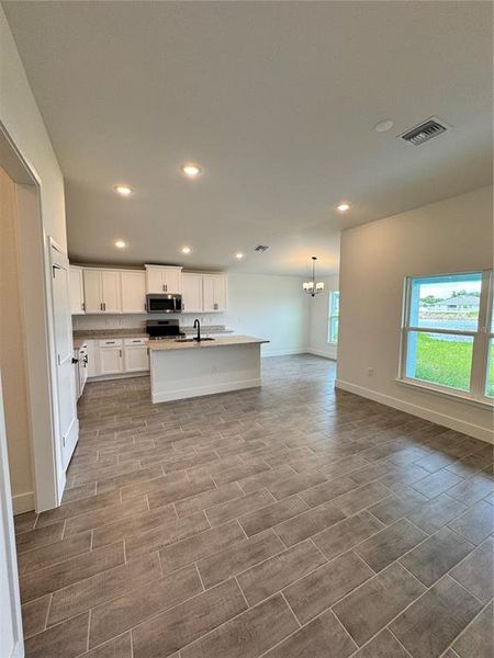 Spacious, unfurnished interior of a new home in Watercress Cove, North Port (Image 10).