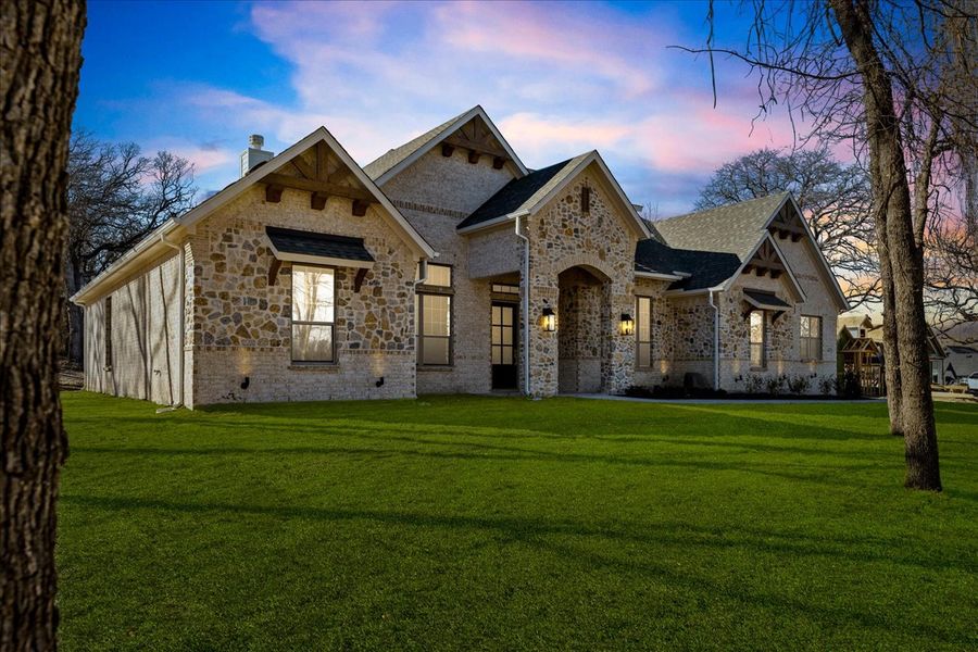 Front exterior of a new home in Brooks Meadow, Weatherford, TX, highlighting curb appeal (Image 32). Front exterior of a new home in Brooks Meadow, Weatherford, TX, highlighting curb appeal (Image 32).