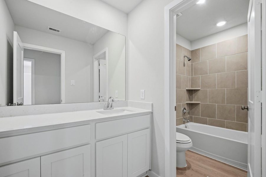 Furnished interior view inside a new home in Barrett Crossing, Crosby (Image 13).