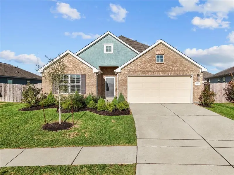 Front exterior of a new home in Mustang Crossing, Alvin, TX, highlighting curb appeal (Image 22).
