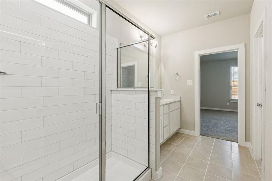 Primary Bathroom in the Stanley II home plan by Trophy Signature Homes – REPRESENTATIVE PHOTO