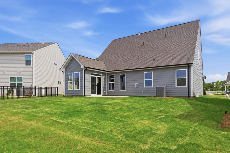 Exterior details and patio area of a home in Villas at Prestwick, Mooresville (Image 15).