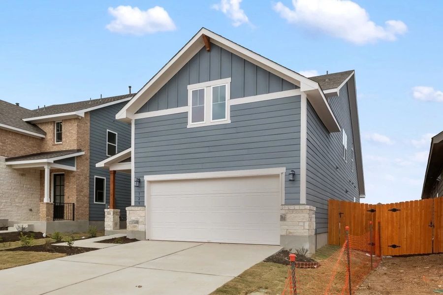 Front exterior of a new home in Lariat, Liberty Hill, TX, highlighting curb appeal (Image 24).
