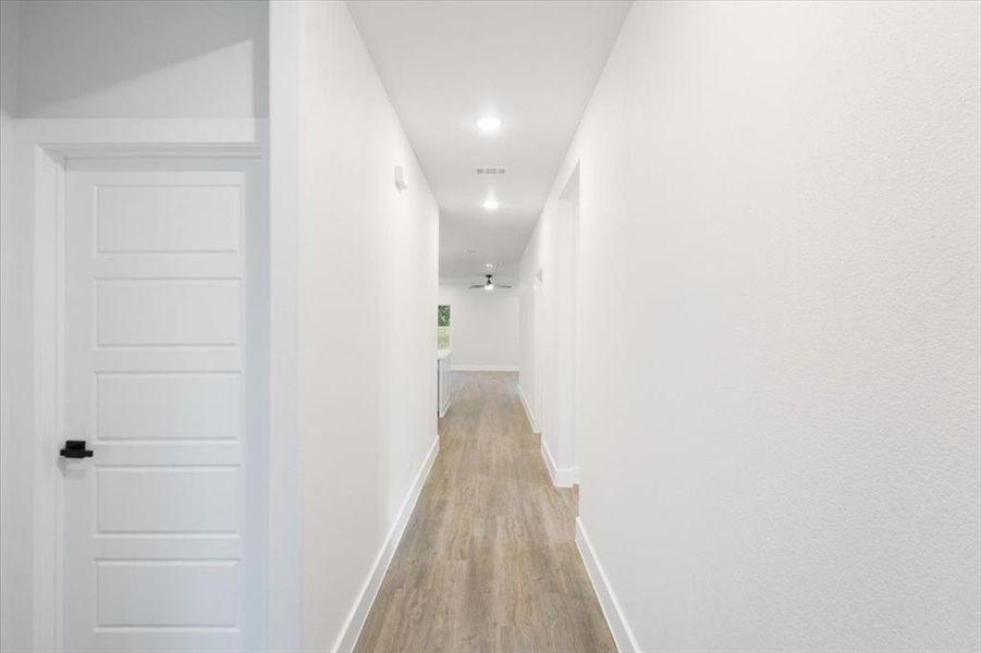 Corridor with wood-type flooring