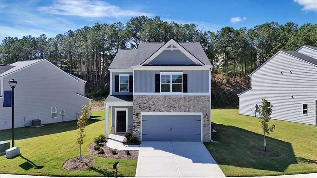 Front exterior of a new home in The View at Groover's Lake, Lithia Springs, GA, highlighting curb appeal (Image 1). Front exterior of a new home in The View at Groover's Lake, Lithia Springs, GA, highlighting curb appeal (Image 1).