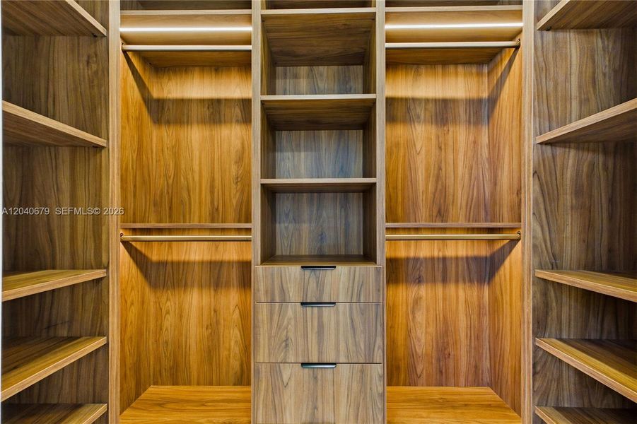The luxurious owner's suite features dual walk-in closets