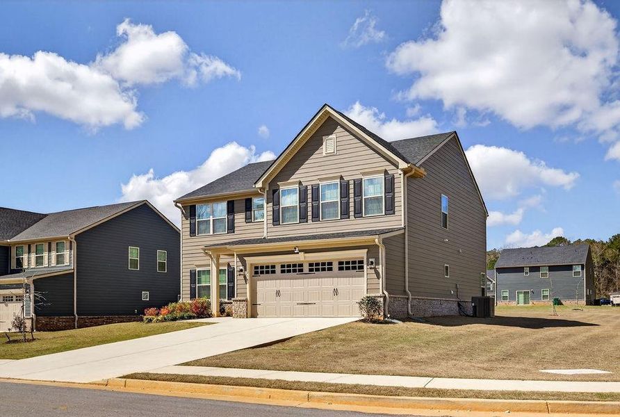 Front exterior of a new home in , McDonough, GA, highlighting curb appeal (Image 19).