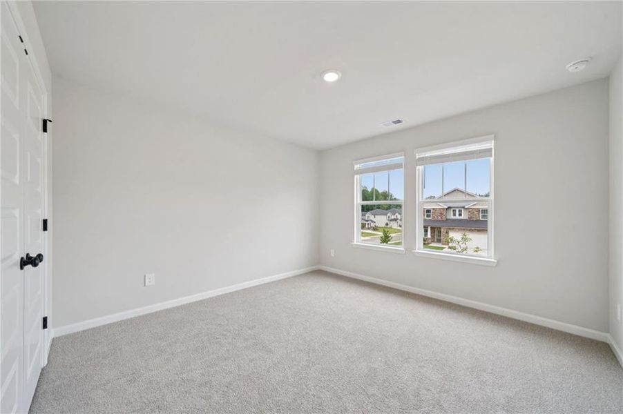 Spacious, unfurnished interior of a new home in Vines at Mill Creek - Estate Series, Braselton (Image 40).