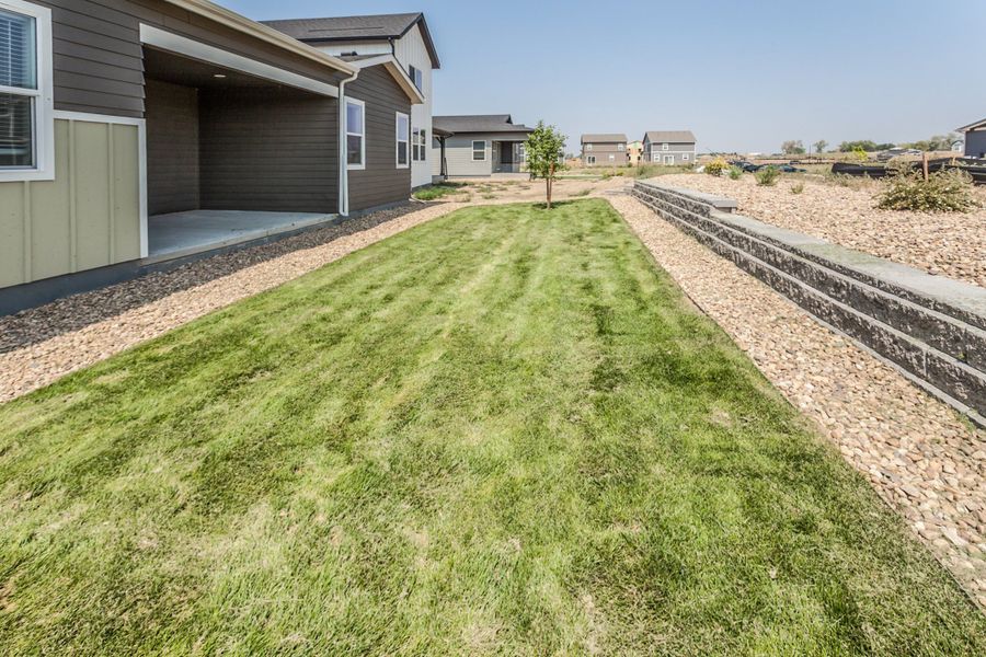 Exterior details and patio area of a home in Prairie Song, Windsor (Image 27).