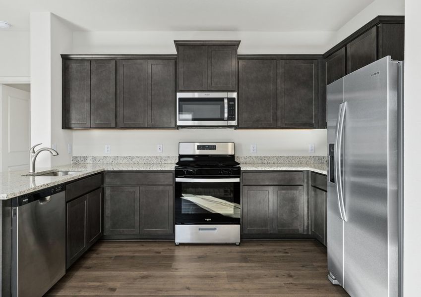 The kitchen has energy-efficient, stainless-steel appliances.