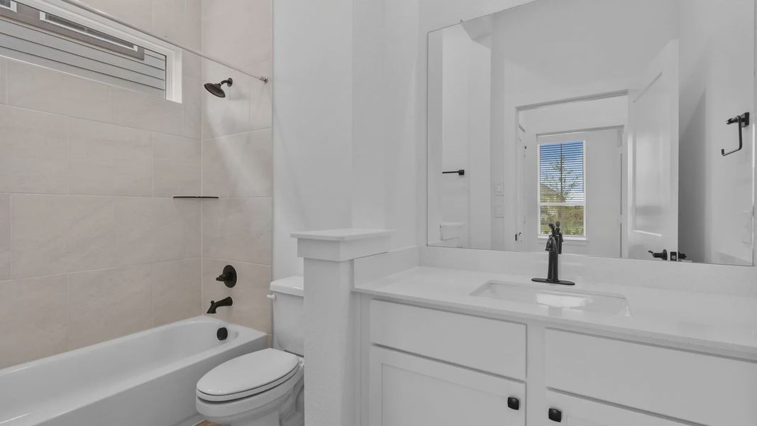 Furnished interior view inside a new home in Wildrye 45', Waller (Image 6).