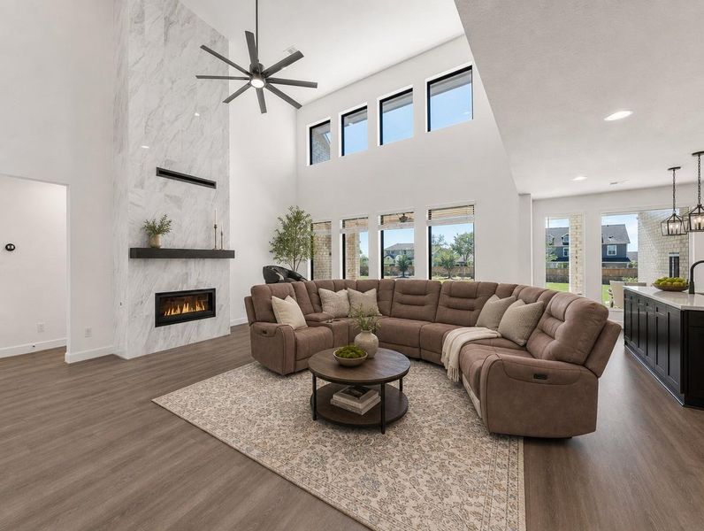 High ceilings complement the integrated fireplace, creating an inviting living space with ample natural light. High ceilings complement the integrated fireplace, creating an inviting living space with ample natural light.