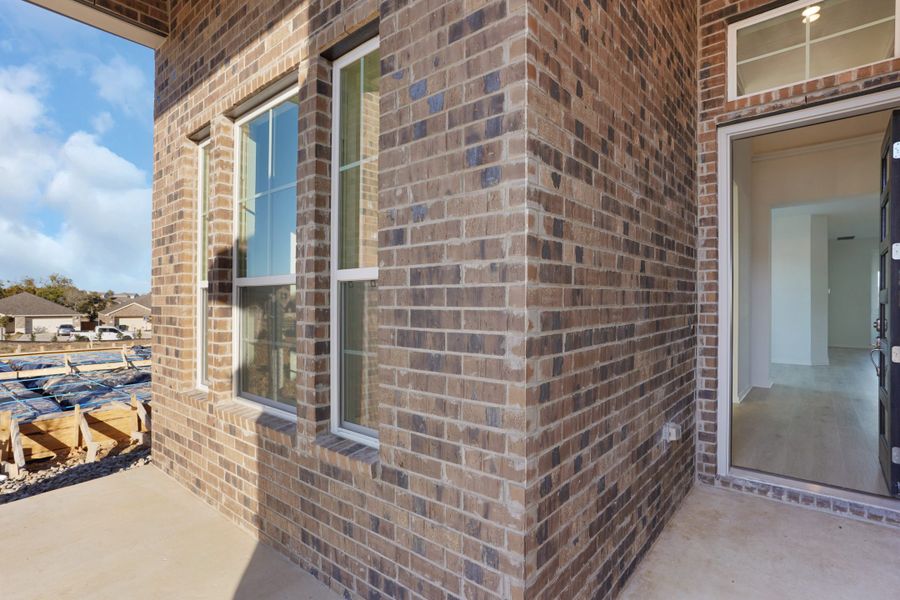 Exterior details and patio area of a home in The Grove at Blackhawk, Pflugerville (Image 30). Exterior details and patio area of a home in The Grove at Blackhawk, Pflugerville (Image 30).